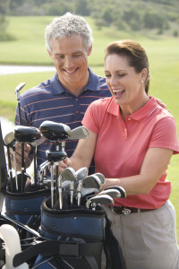 Couple playing golf.